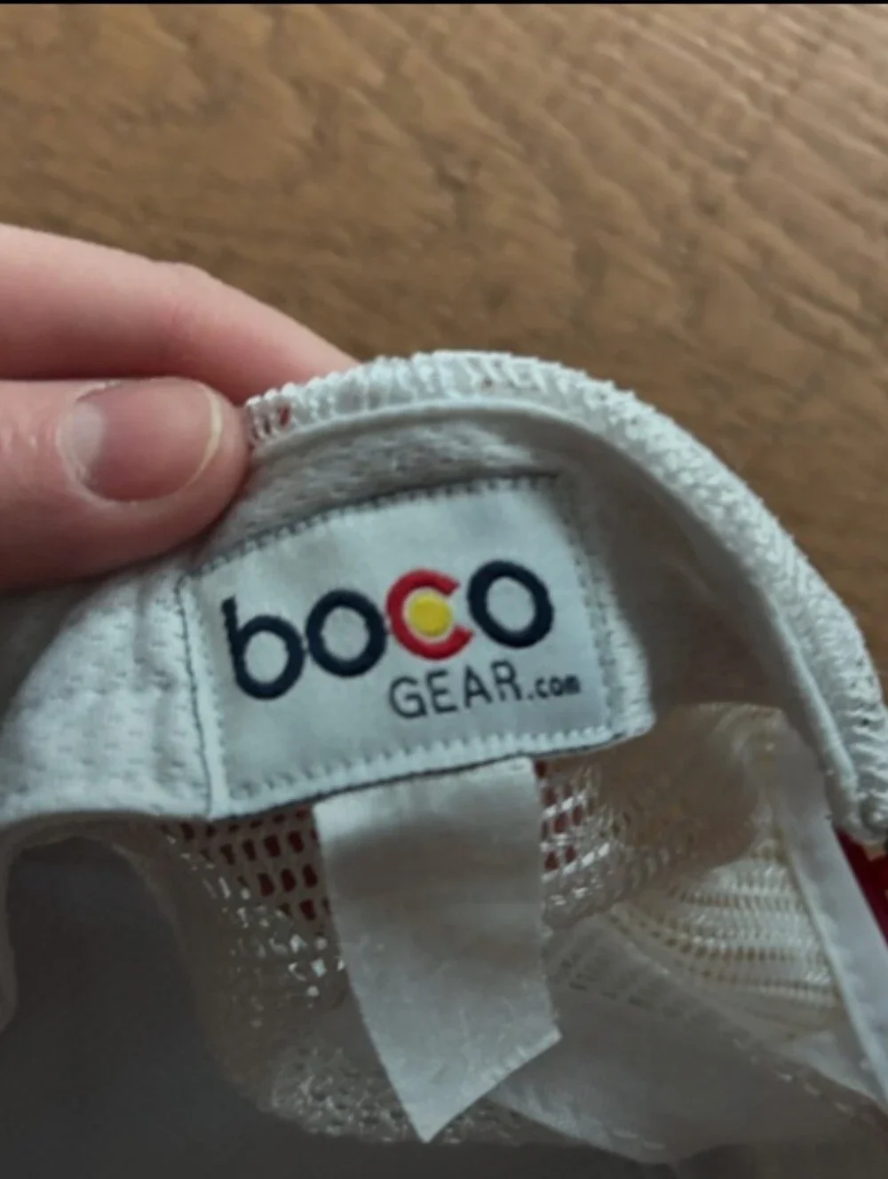 Saucony Black Running Hat with Red Patch and Pink Graphic Lines